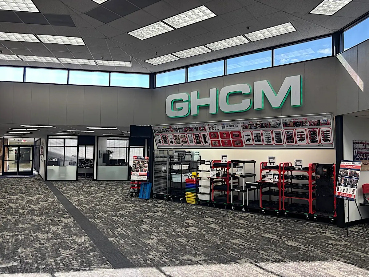 GHCM showroom with product displays under a green GHCM sign