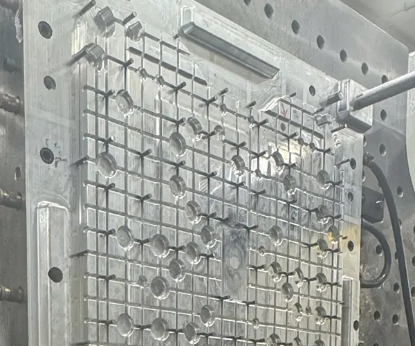 Close-up of a machined aluminum injection mold cavity