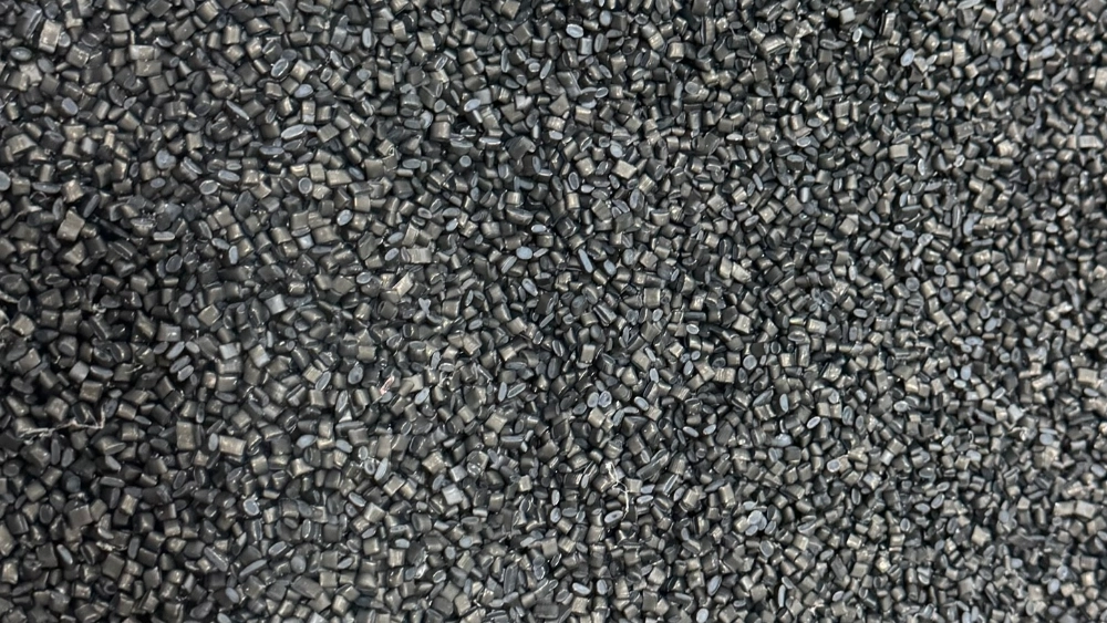 Close-up of black plastic resin pellets