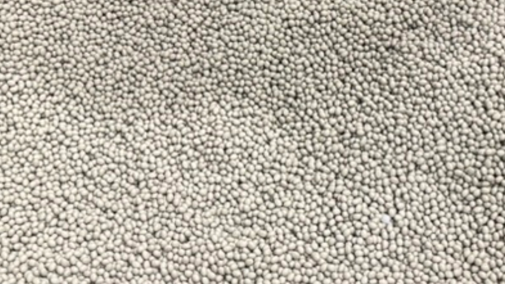 Close-up of gray plastic resin pellets